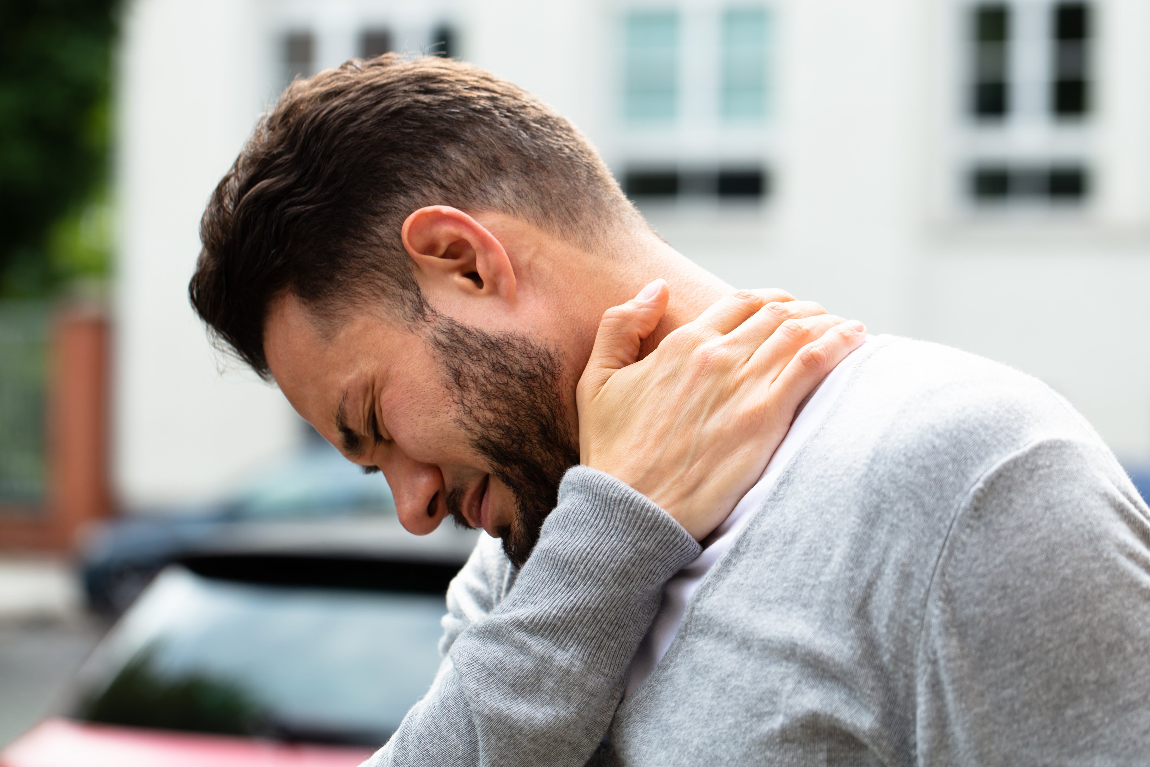 Man Suffering From Neck Pain